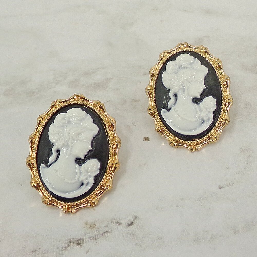 Oval cameo earrings in black and white in a Victorian gold frame setting